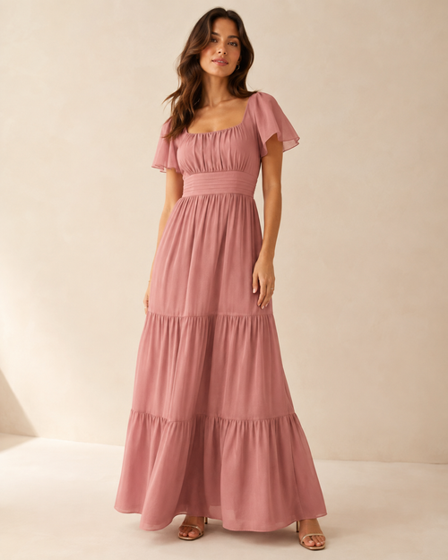 Model wearing the dusty-rose Aurora Bloom Maxi Dress in a full-length front view