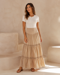 Model wearing the warm-sand Golden Hour Tiered Maxi Skirt in a front view