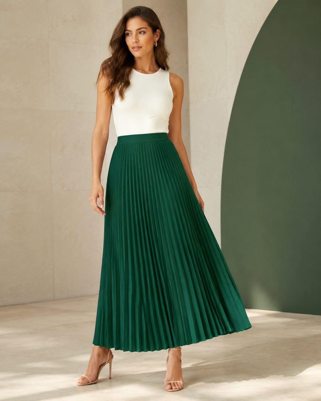 Model wearing the emerald Maribel Pleated Maxi Skirt in a full-length front view