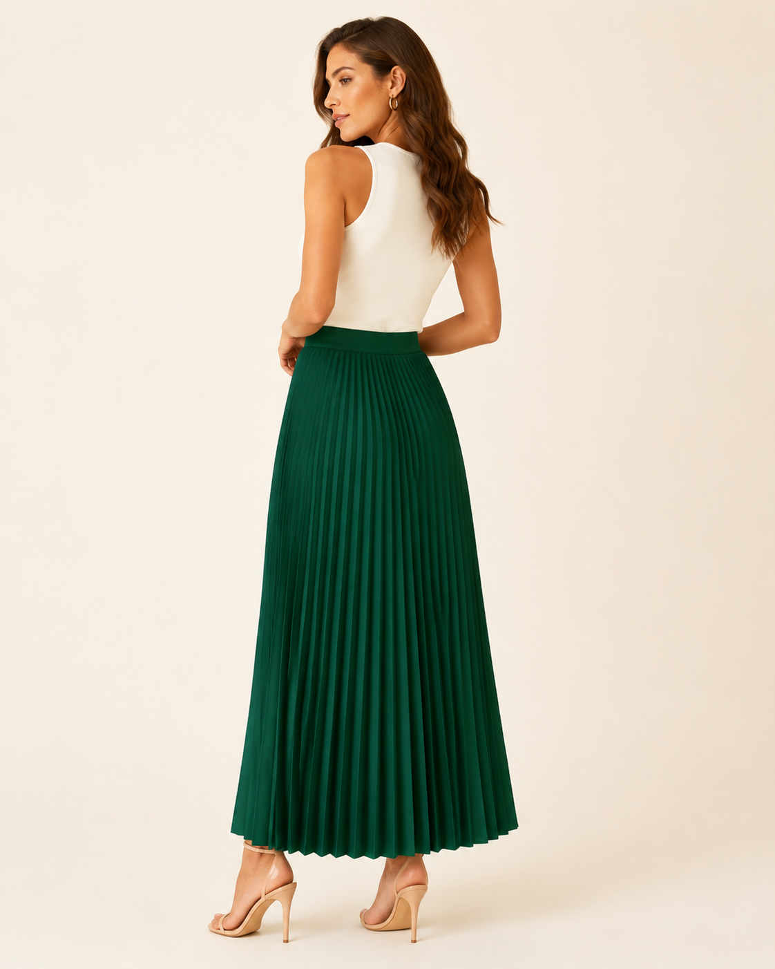 Model wearing the Maribel Pleated Maxi Skirt from a back three-quarter view